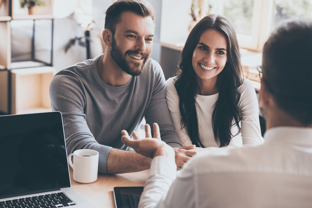 Happy Couple talking about home protection Insurance